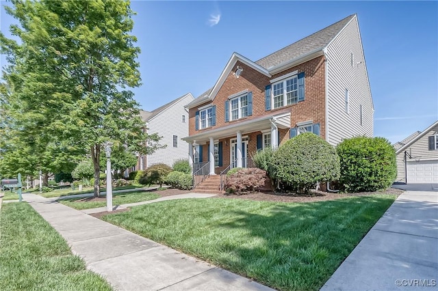 11420 Willows Green Way, Glen Allen, VA 23059 - view of front of home featuring brick siding, covered porch, and a front lawn
