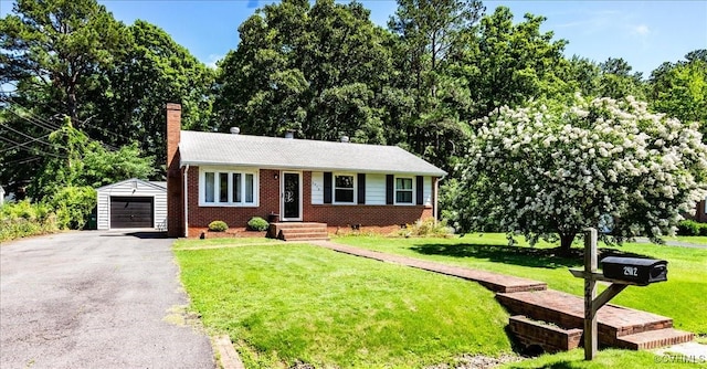 2412 Omega Rd, Henrico, VA 23228 - ranch-style home with an outdoor structure, a chimney, brick siding, a detached garage, and driveway