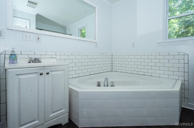 2412 Omega Rd, Henrico, VA 23228 - full bathroom featuring vanity, a bath, and ornamental molding