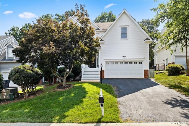 2925 Mariners Pl, Midlothian, VA 23112 - traditional-style home with asphalt driveway, a garage, a front yard, and brick siding