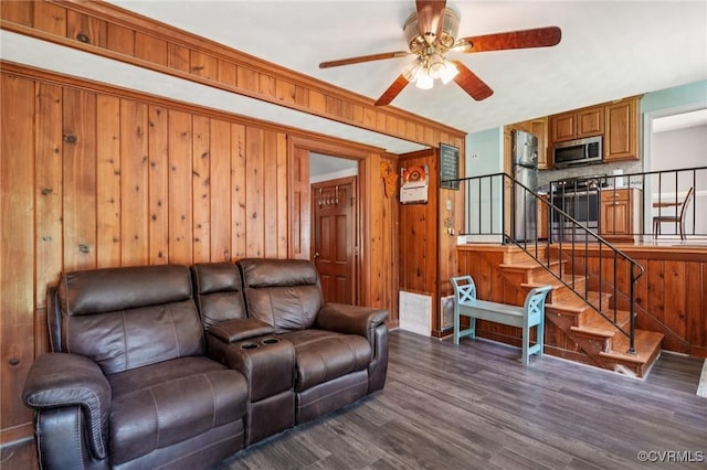 301 Perth Ln, Sandston, VA 23150 - living room featuring ceiling fan, dark wood-type flooring, wooden walls, and stairs