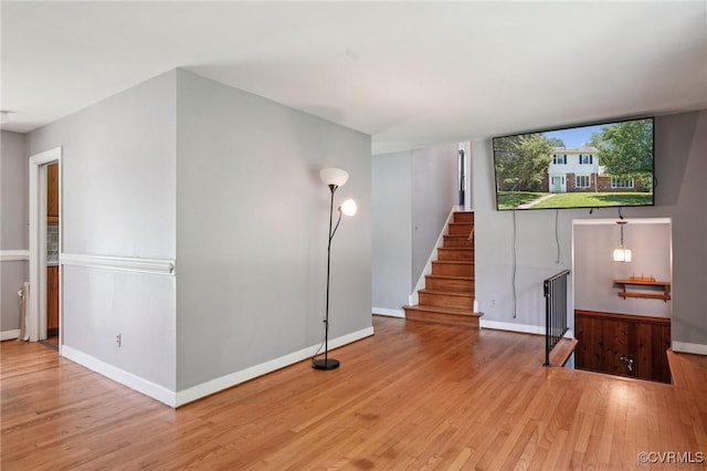 301 Perth Ln, Sandston, VA 23150 - unfurnished living room with wood finished floors and stairway
