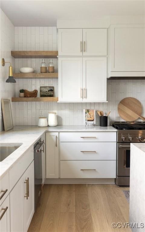 4812 Lake Summer Loop, Moseley, VA 23120 - kitchen featuring appliances with stainless steel finishes, open shelves, light wood finished floors, backsplash, and white cabinets