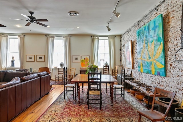 22 N Sycamore St, Petersburg, VA 23803 - dining space with light wood-type flooring, rail lighting, a ceiling fan, and recessed lighting