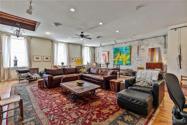 22 N Sycamore St, Petersburg, VA 23803 - living room with rail lighting, a ceiling fan, hardwood / wood-style flooring, and recessed lighting