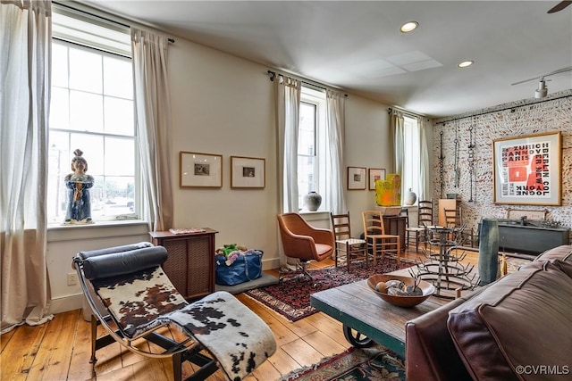 22 N Sycamore St, Petersburg, VA 23803 - sitting room featuring plenty of natural light, an accent wall, wood-type flooring, and recessed lighting