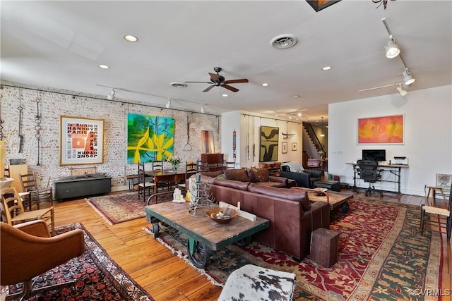 22 N Sycamore St, Petersburg, VA 23803 - living room with rail lighting, a ceiling fan, hardwood / wood-style flooring, wallpapered walls, and stairway