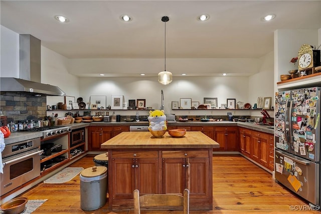 22 N Sycamore St, Petersburg, VA 23803 - kitchen with wall chimney exhaust hood, stainless steel appliances, wooden counters, light wood finished floors, and recessed lighting