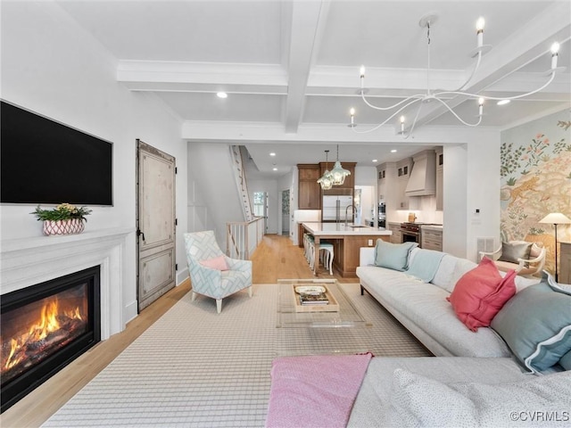 511 Libbie Ave Unit C, Richmond, VA 23226 - living area featuring a chandelier, coffered ceiling, light wood-type flooring, beam ceiling, and crown molding