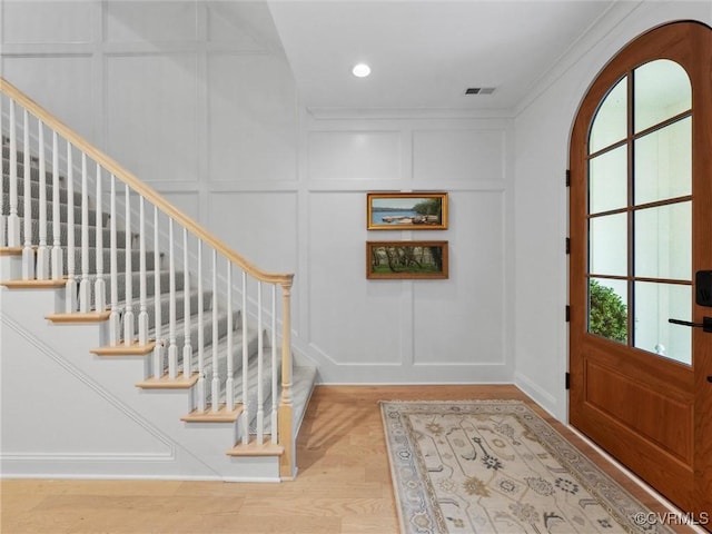 511 Libbie Ave Unit C, Richmond, VA 23226 - entryway featuring a decorative wall, stairway, recessed lighting, wood finished floors, and ornamental molding