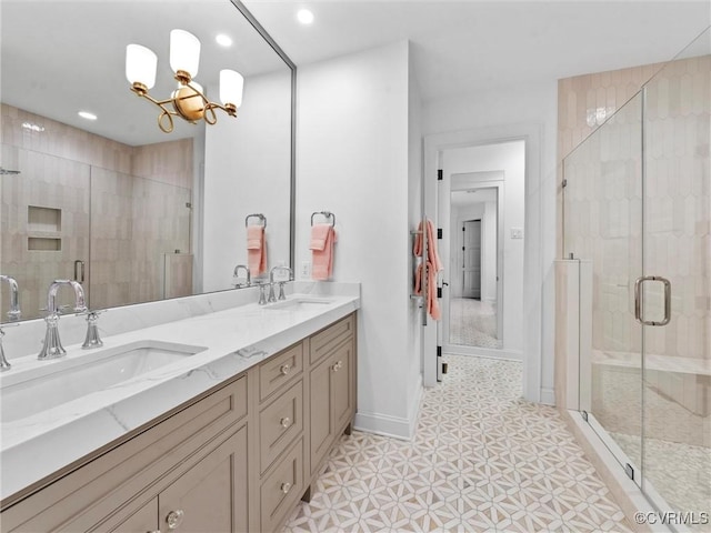 511 Libbie Ave Unit C, Richmond, VA 23226 - bathroom with double vanity, a shower stall, a chandelier, and recessed lighting