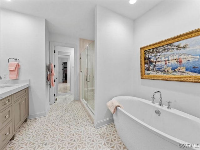 511 Libbie Ave Unit C, Richmond, VA 23226 - full bathroom with a soaking tub, a shower stall, vanity, and tile patterned floors
