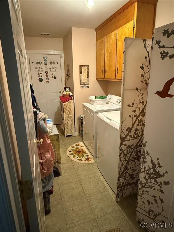 9812 Nott Ln, Chesterfield, VA 23832 - washroom featuring cabinet space, separate washer and dryer, and light tile patterned floors