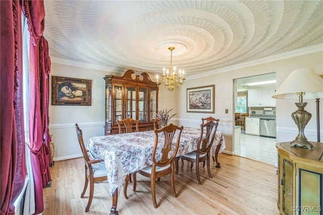 1413 N Mill Point Ct, Suffolk, VA 23434 - dining area featuring a chandelier, light wood-style floors, ornamental molding, and a wainscoted wall