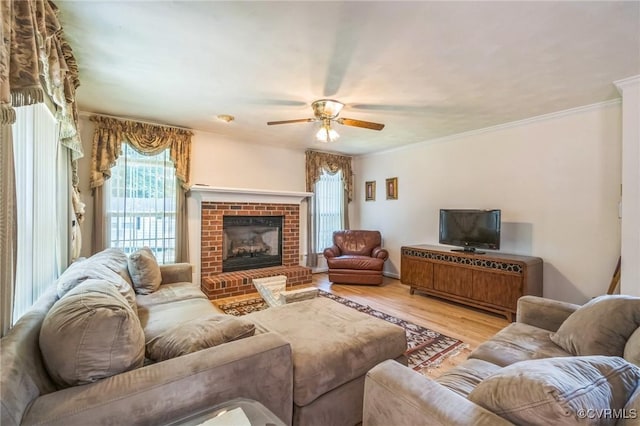 1413 N Mill Point Ct, Suffolk, VA 23434 - living area with plenty of natural light, a ceiling fan, wood finished floors, a brick fireplace, and ornamental molding