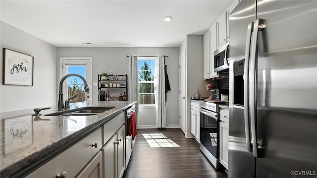1954 Kennington Park Rd, Aylett, VA 23009 - kitchen featuring appliances with stainless steel finishes, dark wood-style flooring, stone counters, recessed lighting, and white cabinetry