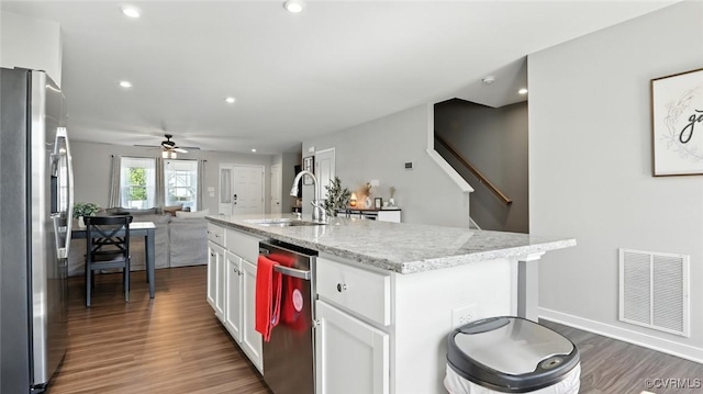 1954 Kennington Park Rd, Aylett, VA 23009 - kitchen featuring appliances with stainless steel finishes, open floor plan, white cabinets, ceiling fan, and dark wood-style floors