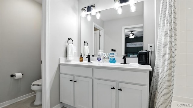 1954 Kennington Park Rd, Aylett, VA 23009 - bathroom with double vanity, ceiling fan, and tile patterned flooring