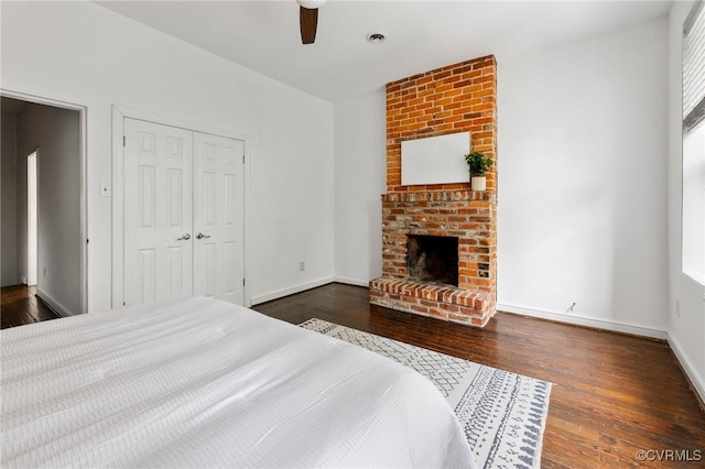 118 N Lombardy St, Richmond, VA 23220 - bedroom with dark wood-style flooring, a fireplace, and a closet