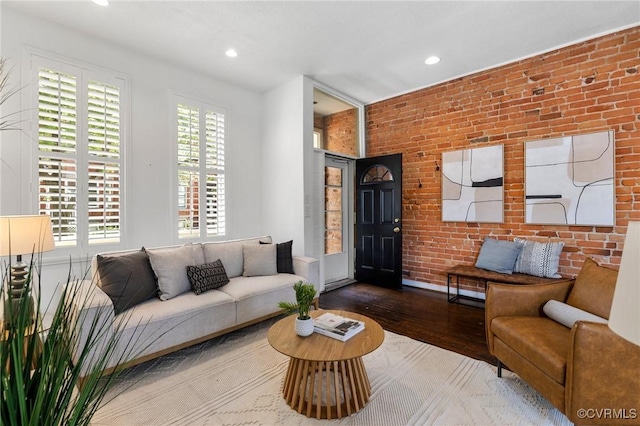 118 N Lombardy St, Richmond, VA 23220 - living room with wood finished floors, brick wall, and recessed lighting