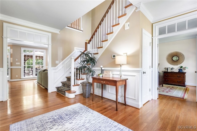 8707 Taylor Landing Pl, Chesterfield, VA 23838 - foyer entrance featuring wood finished floors, stairs, a decorative wall, ornamental molding, and a wainscoted wall