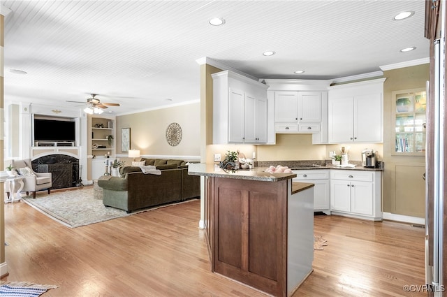 8707 Taylor Landing Pl, Chesterfield, VA 23838 - kitchen with crown molding, a ceiling fan, white cabinets, light wood-style floors, and recessed lighting
