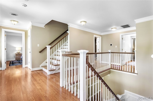 8707 Taylor Landing Pl, Chesterfield, VA 23838 - corridor featuring ornamental molding, light wood-style floors, and an upstairs landing