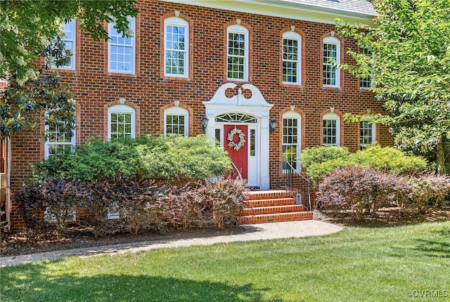 8707 Taylor Landing Pl, Chesterfield, VA 23838 - colonial inspired home featuring a front lawn and brick siding