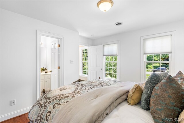 8707 Taylor Landing Pl, Chesterfield, VA 23838 - bedroom featuring wood finished floors and connected bathroom