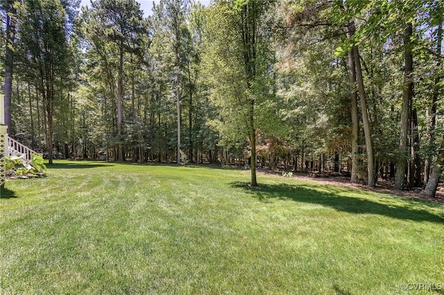 8707 Taylor Landing Pl, Chesterfield, VA 23838 - view of green lawn with a wooded view