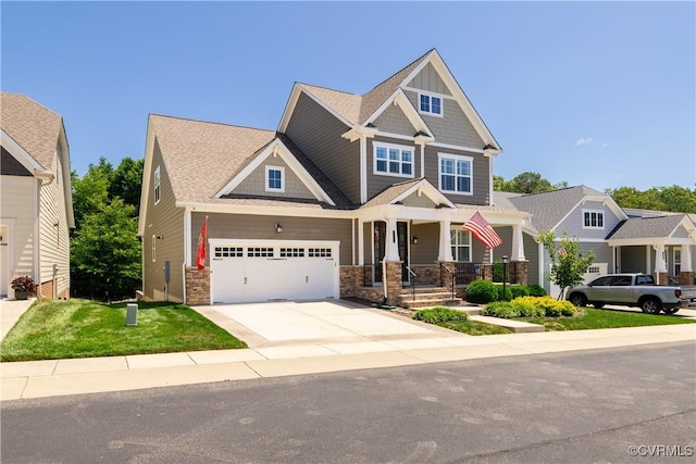 2449 Gold Leaf Cir, Henrico, VA 23233 - craftsman house with driveway, covered porch, stone siding, and a front yard