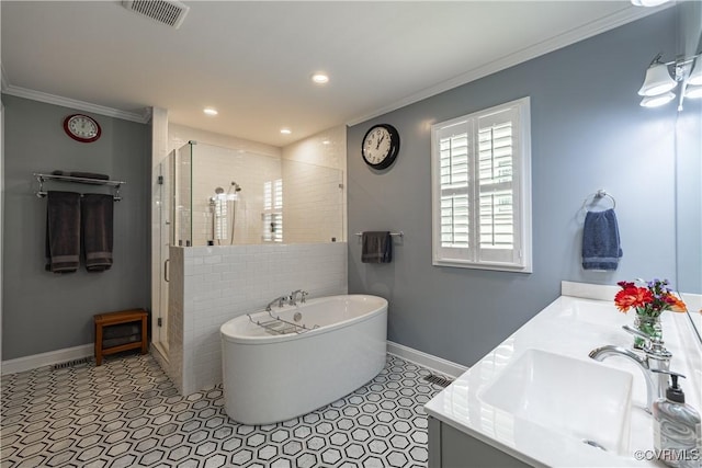 2449 Gold Leaf Cir, Henrico, VA 23233 - bathroom featuring a stall shower, a freestanding tub, ornamental molding, double vanity, and recessed lighting