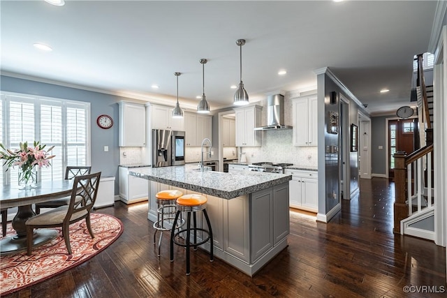 2449 Gold Leaf Cir, Henrico, VA 23233 - kitchen featuring wall chimney range hood, stainless steel fridge, decorative backsplash, a kitchen island with sink, and dark wood-style floors