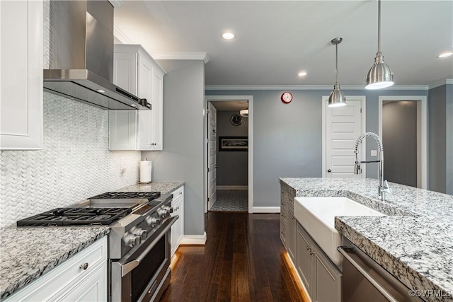 2449 Gold Leaf Cir, Henrico, VA 23233 - kitchen featuring wall chimney exhaust hood, appliances with stainless steel finishes, dark wood-style flooring, backsplash, and light stone counters