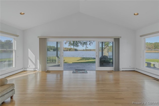 585 White Hall Rd, Montross, VA 22520 - unfurnished living room featuring vaulted ceiling, wood finished floors, a water view, and recessed lighting