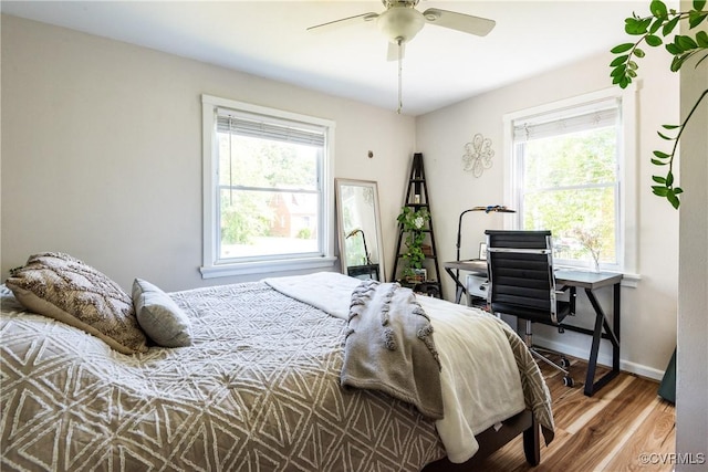 3712 Moody Ave, Richmond, VA 23225 - bedroom with multiple windows, wood finished floors, and a ceiling fan