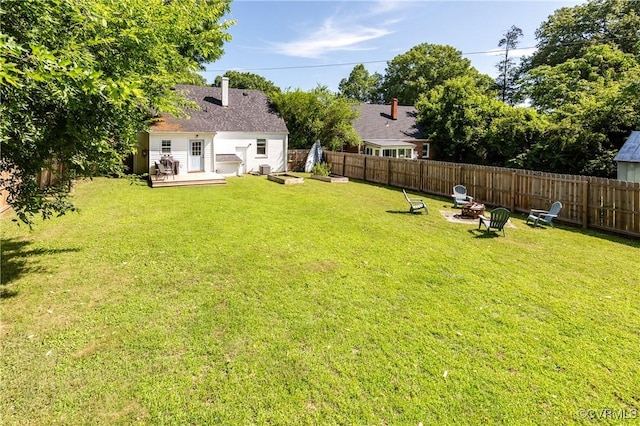 3712 Moody Ave, Richmond, VA 23225 - fenced backyard featuring a deck and a fire pit