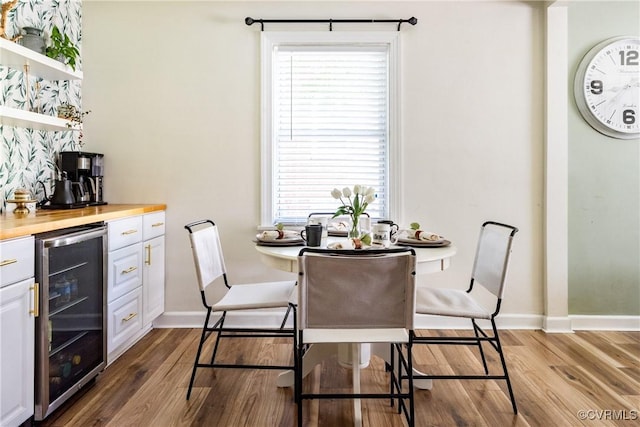 3712 Moody Ave, Richmond, VA 23225 - dining space featuring beverage cooler, dark wood finished floors, and plenty of natural light