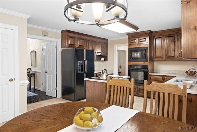 14230 Netherfield Dr, Midlothian, VA 23113 - kitchen with black appliances, light countertops, ornamental molding, and a kitchen island with sink