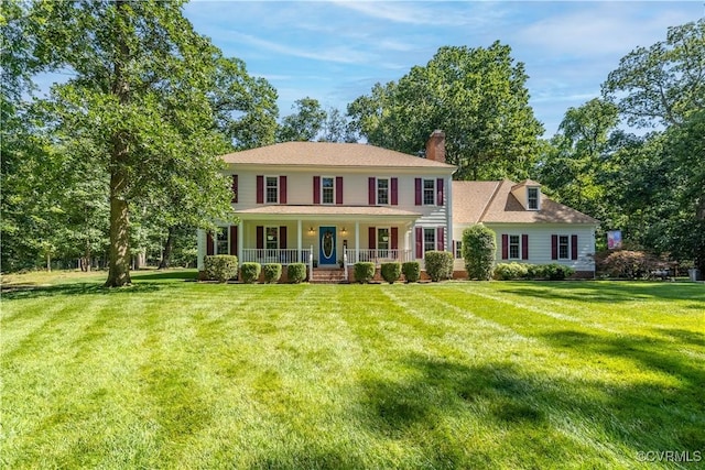 14230 Netherfield Dr, Midlothian, VA 23113 - colonial inspired home with covered porch, a front yard, and a chimney