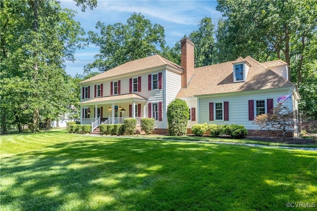 14230 Netherfield Dr, Midlothian, VA 23113 - colonial inspired home featuring a porch, a chimney, a front lawn, and roof with shingles