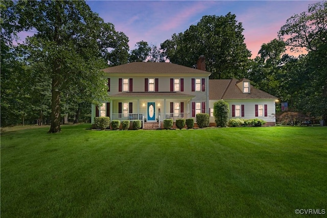 14230 Netherfield Dr, Midlothian, VA 23113 - colonial house with a porch, a front yard, and a chimney