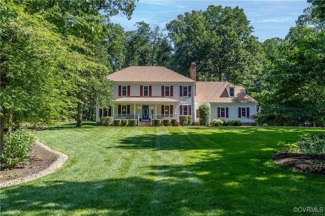 14230 Netherfield Dr, Midlothian, VA 23113 - colonial house featuring covered porch, a front lawn, and a chimney