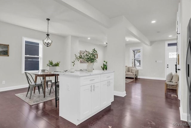 605 Northside Ave, Richmond, VA 23222 - kitchen with dark wood-style flooring, white cabinetry, hanging light fixtures, light countertops, and recessed lighting