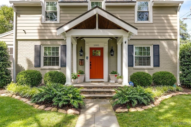 5005 Caledonia Rd, Richmond, VA 23225 - view of front facade with brick siding and a porch