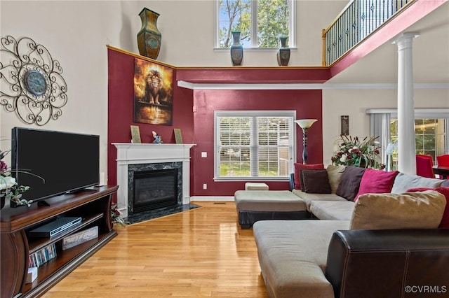 301 Enon Oaks Ln, Chesterfield, VA 23836 - living room featuring a high ceiling, wood finished floors, a premium fireplace, decorative columns, and ornamental molding