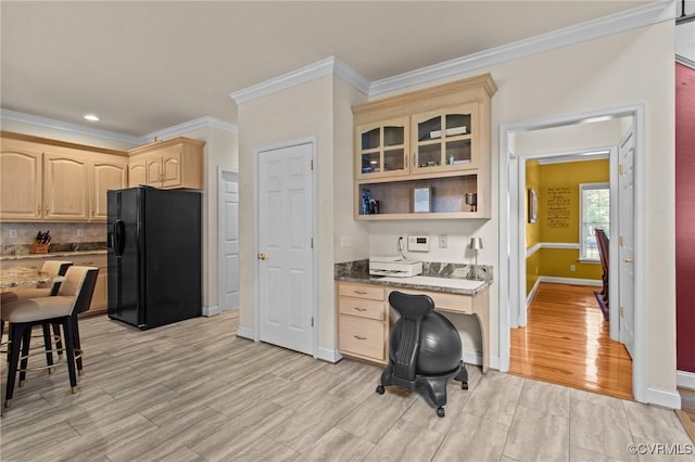 301 Enon Oaks Ln, Chesterfield, VA 23836 - kitchen with black refrigerator with ice dispenser, light brown cabinetry, ornamental molding, light wood-style flooring, and built in desk