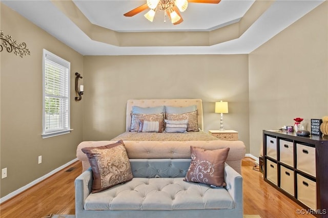 301 Enon Oaks Ln, Chesterfield, VA 23836 - bedroom featuring wood finished floors, a raised ceiling, and ceiling fan