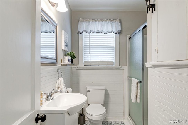 4302 W Franklin St, Richmond, VA 23221 - bathroom featuring healthy amount of natural light, a shower stall, vanity, and wainscoting