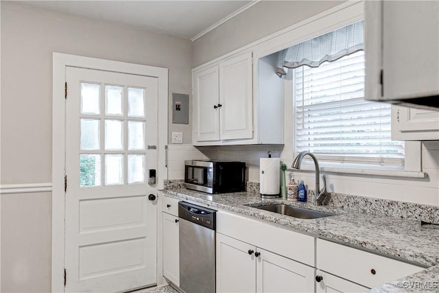 4302 W Franklin St, Richmond, VA 23221 - kitchen with appliances with stainless steel finishes, white cabinetry, and light stone counters